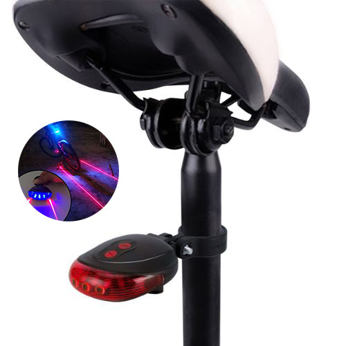USB rechargeable bicycle tail light glowing red on a bike seat post.  
