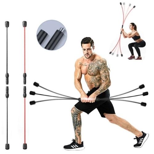 Man exercising with the elastic fitness bar in a living room
