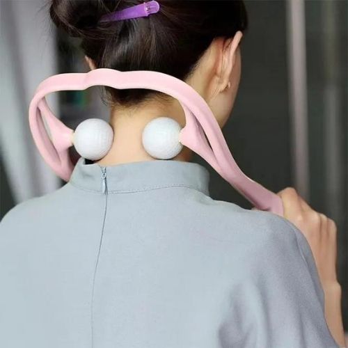 Person massaging their neck with the pressure point massager
